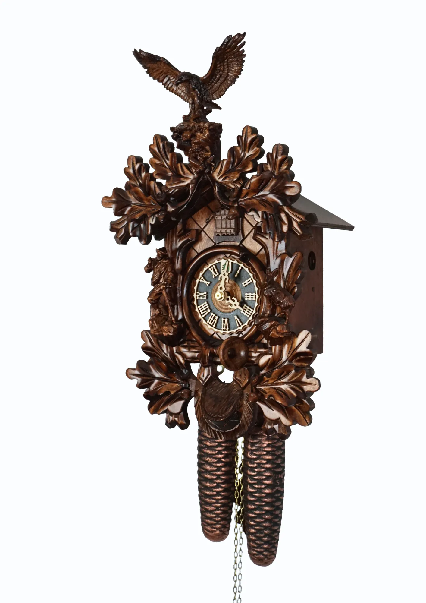 Cuckoo Clock Black Forest Wildlife 8 Day Movement (2) beautifully carved black forest brown mechanical cuckoo clock with an eagle on top of its crown, also decorated with a detailed figure of hunter and mountin goat. The dial is wraped with a hunting horn and beneath it hunting bag is hanging