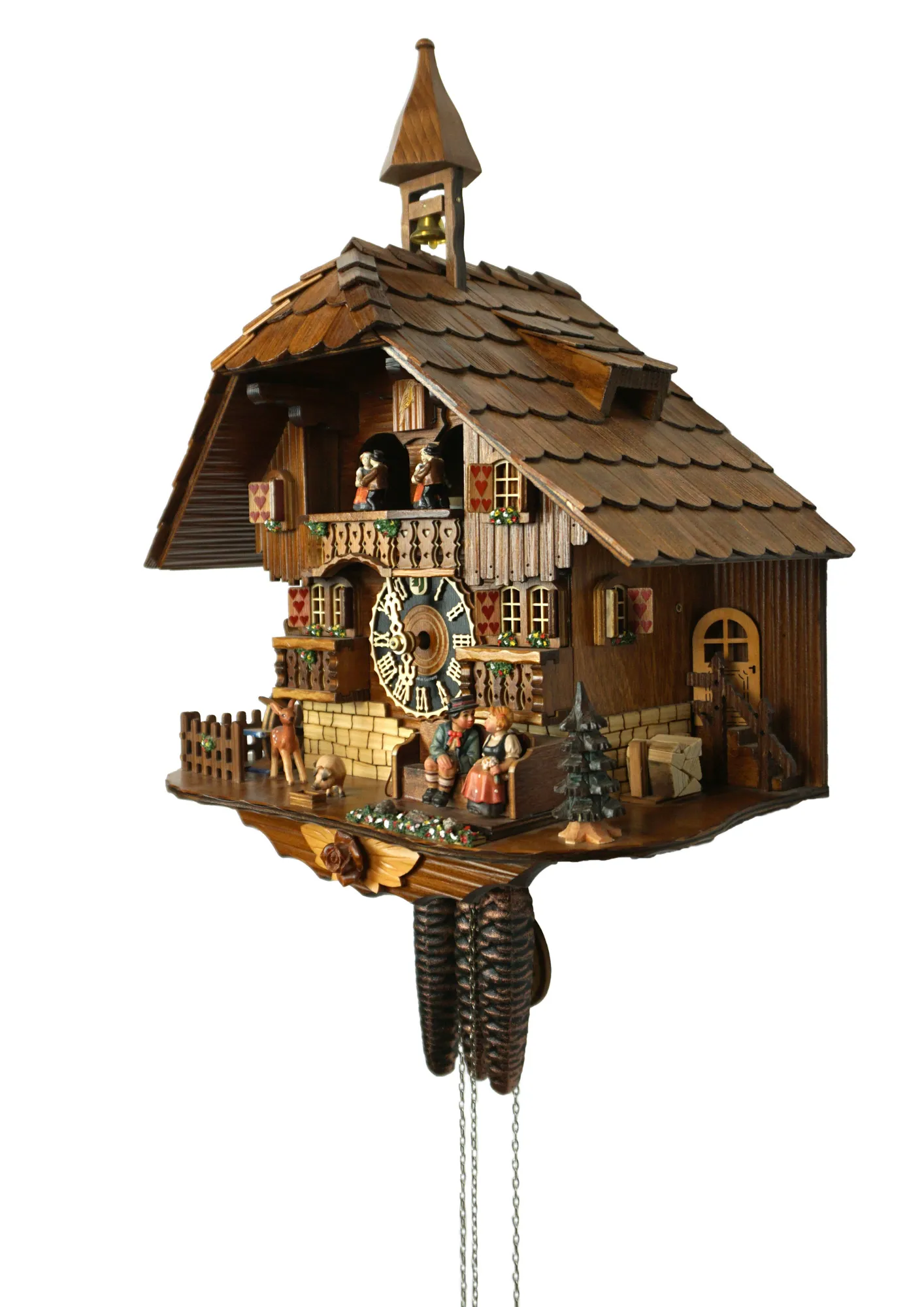 Cuckoo Clock Honeymoon 1 Day Movement with Music (2) Mechanical black forest cuckoo clock decorated to the finest detail, representing a couple on honeymoon sitting on the bench in front of the chalet house sliding thowards each other for a kiss while the music plays, dancers and waterwheel turn