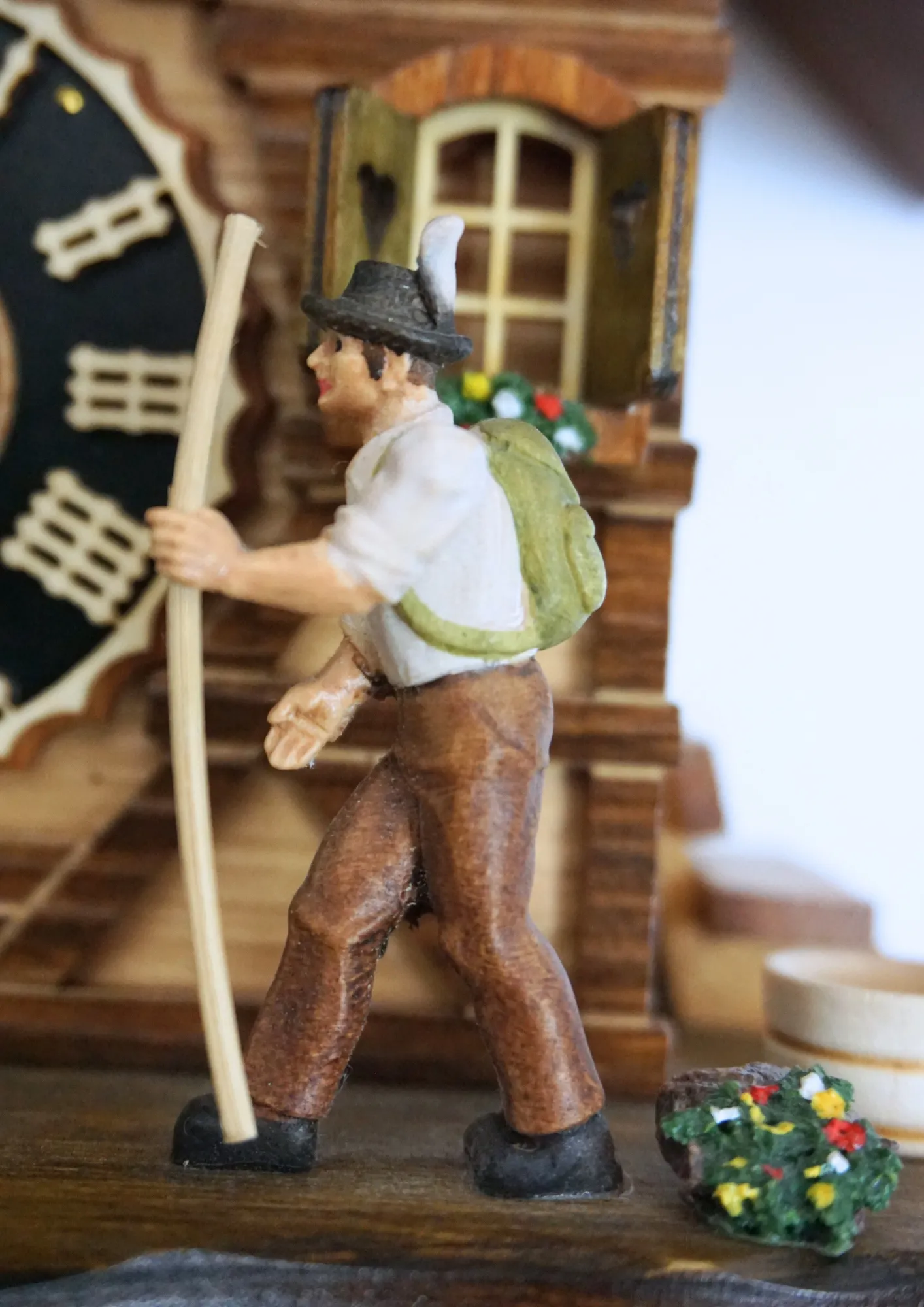 Cuckoo Clock Hiker 1 Day Movement (4) Chalet style red roof beautiful black forest cuckoo clock decorated with edelweiss flowers and a hiker who moves his stick with a cuckoo sound made by Hönes