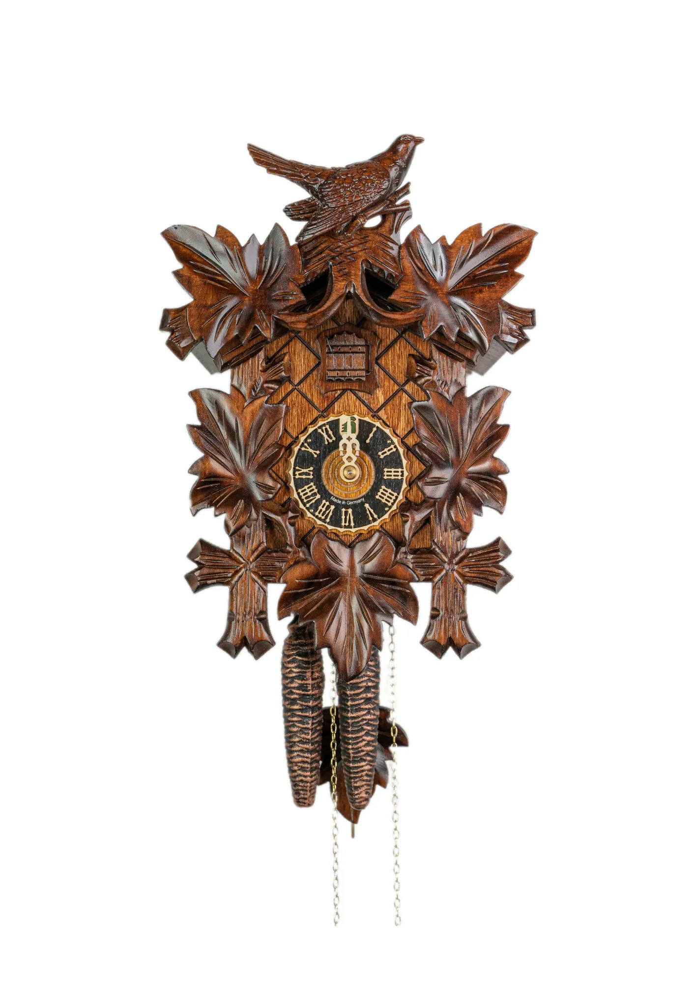 Authentic mechanical brown black forest cuckoo clock with nicely carved cuckoo bird decorating the top made by Hönes