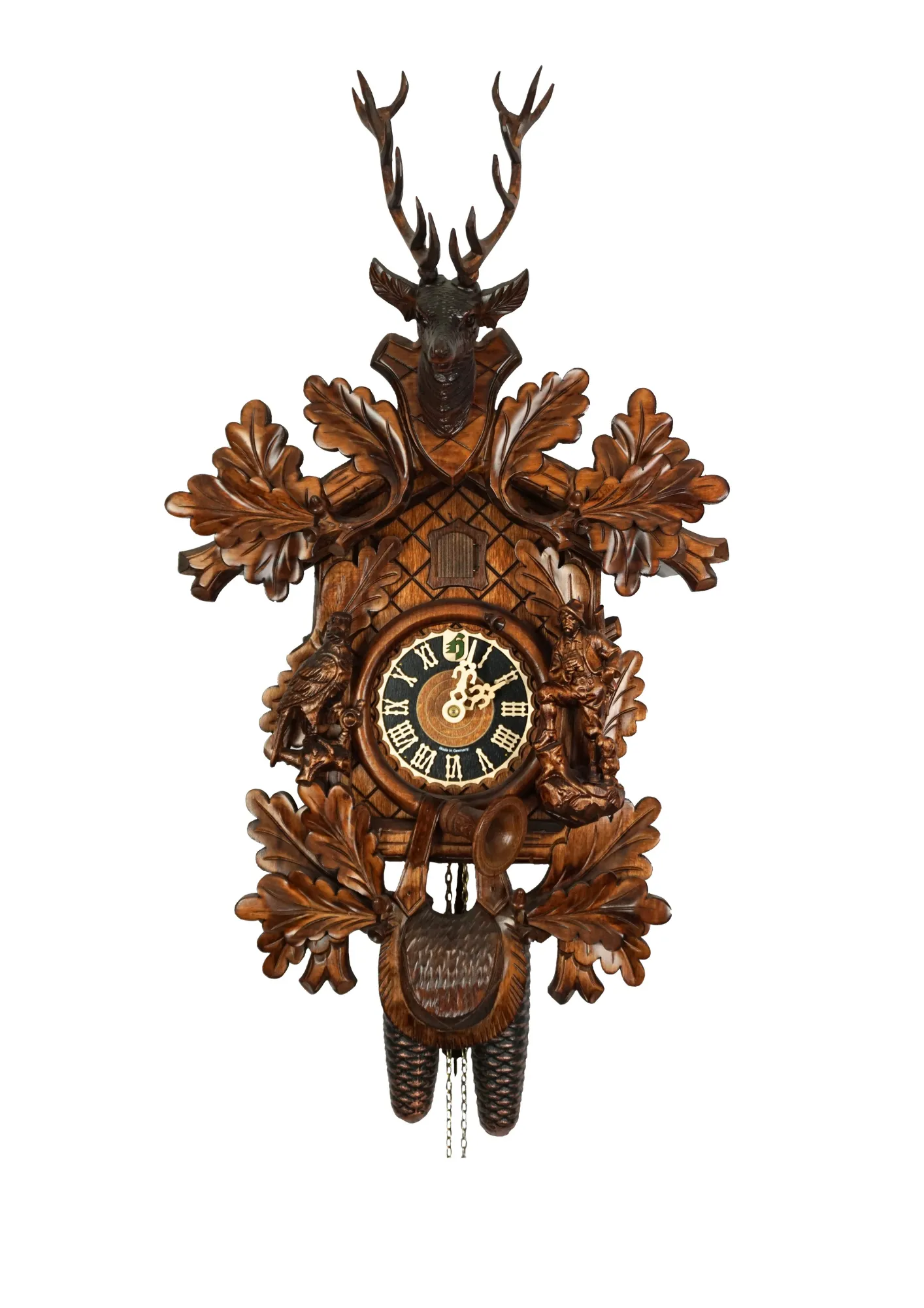 Cuckoo Clock Hunter Clock 8 Day Movement (1) Hand carved authentic mechanical brown black forest cuckoo clock in a hunter theme. Precisely carved deer head is decorating the top while there is a hunter and a falcon figure on the sides of the clock. The clocks dial is wraped with a hunting horn while