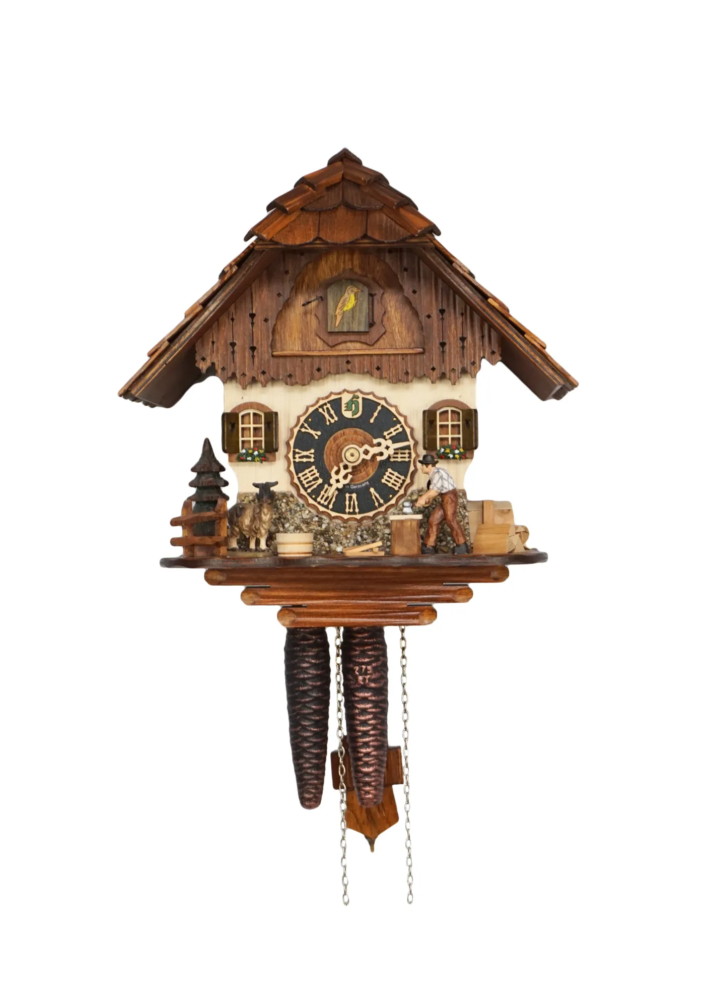 Small mechanical black forest cuckoo clock, chalet house decorated with a real stones with wood chopper and a nicely carved goat, made by Hönes